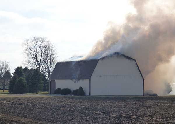 Crews fight barn fire